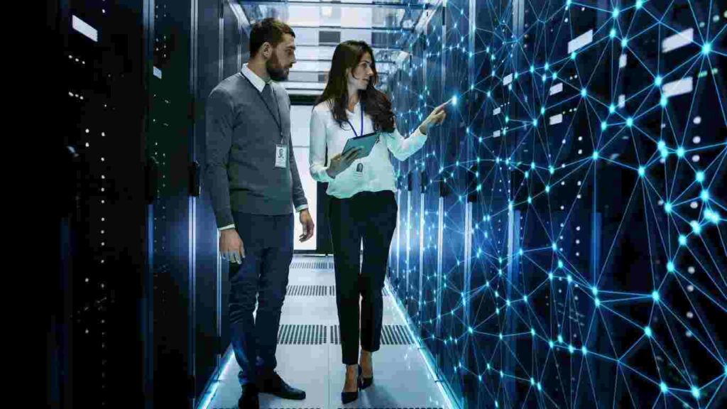 Technicians inspecting server room with network overlay